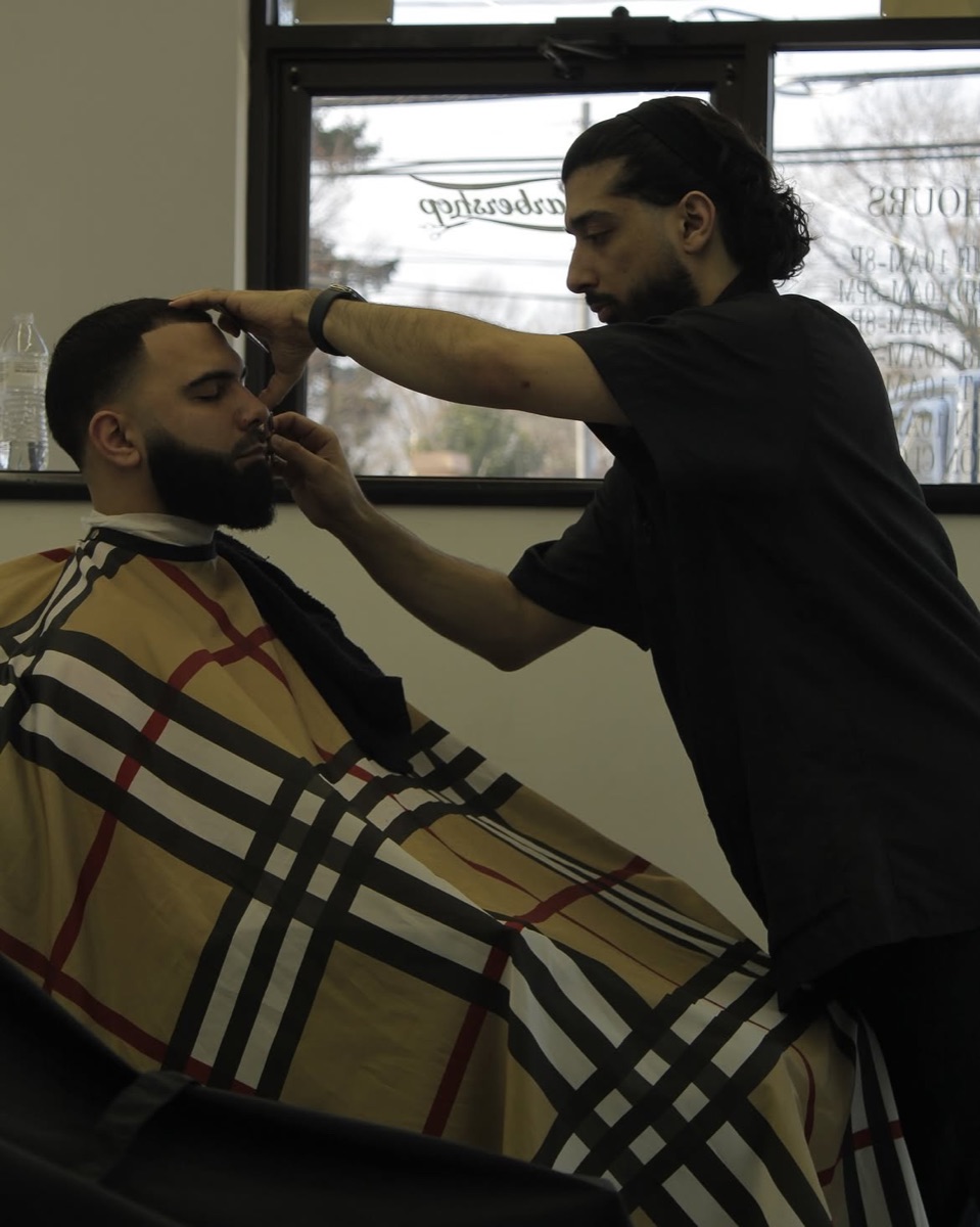 Low fade and sculpted full beard done at Slick Fades
