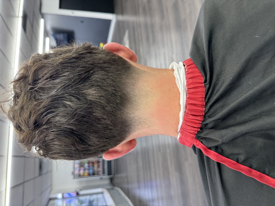 Clean nape taper on a longer scissor cut at Slick Fades